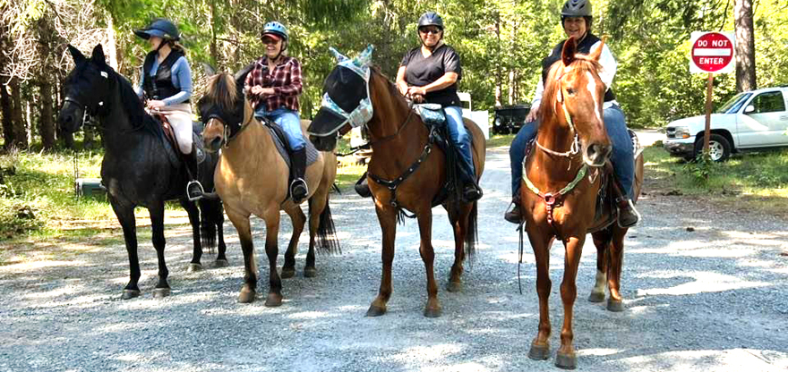 Four Horsewomen on horseback at the Fun Ride